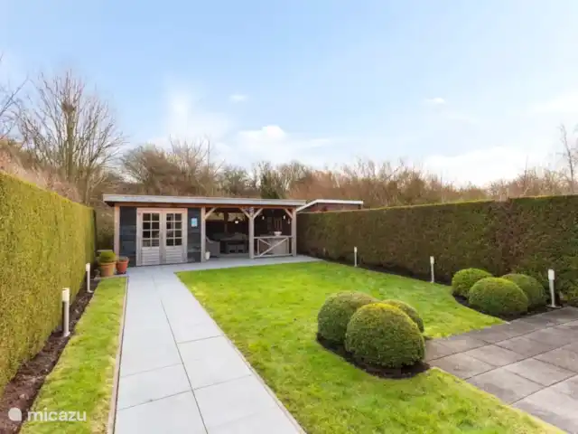 Location de Vacances Pays-Bas, Zélande, Kamperland, maison de vacances - Maison de vacances de luxe près de la plage Jardin de la maison de vacances à Kamperland (Zélande, Pays-Bas)