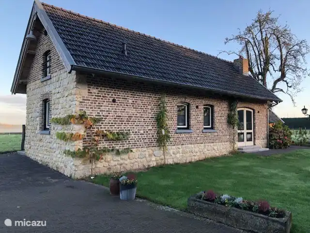 Façade with partial Kunrader stone. (Limestone from local quarry.)