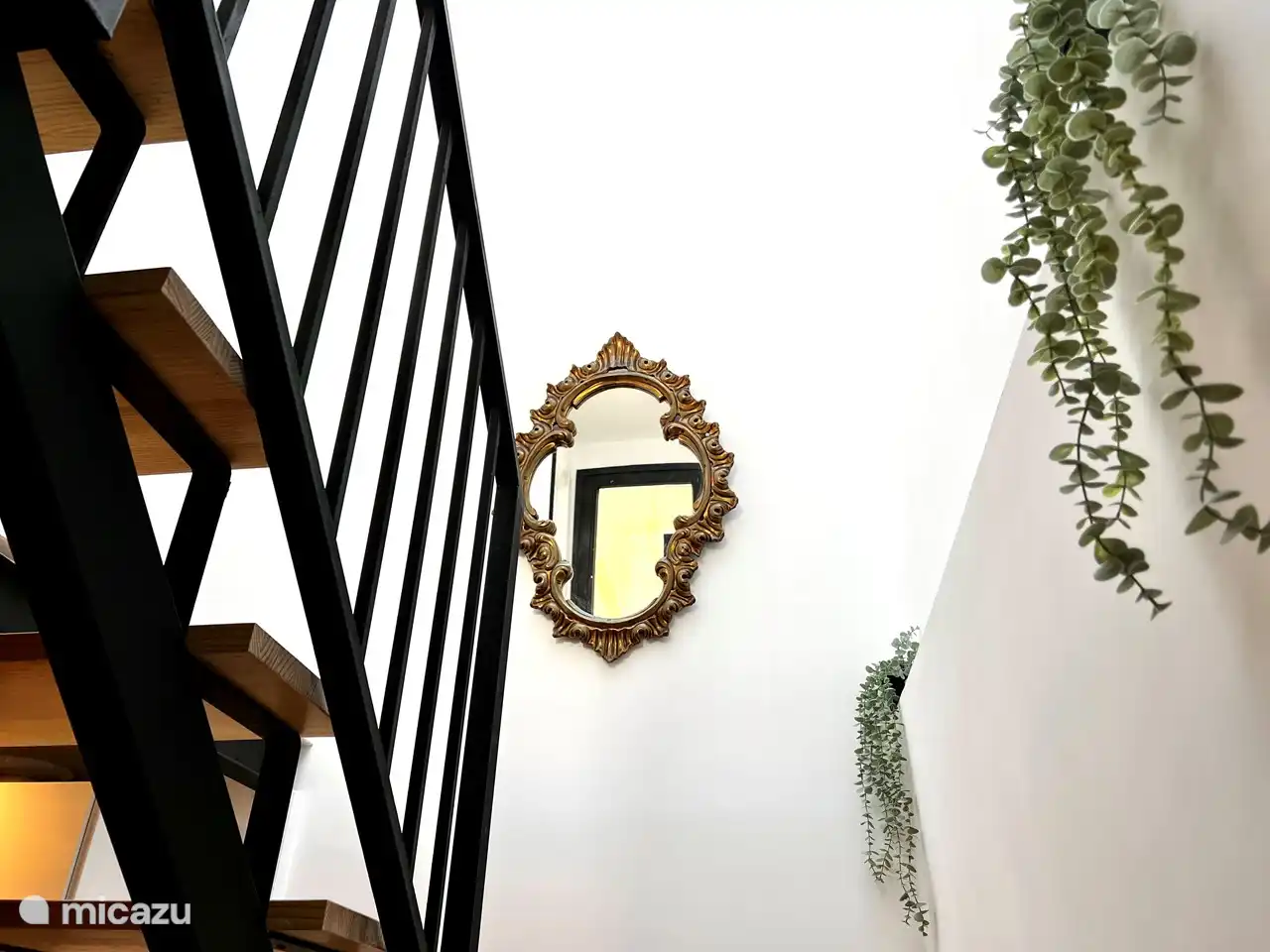 The handmade staircase to the second floor.