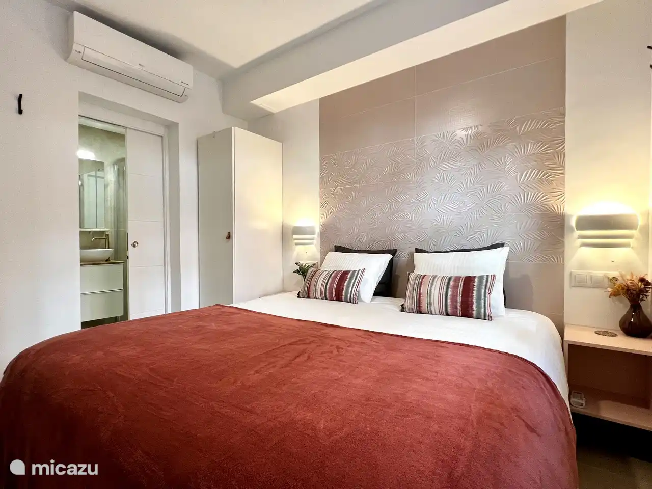 The living room on the ground floor with the en suite bathroom. The toilet is separate in the hallway.