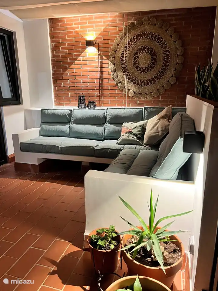 The terrace has cozy mood lighting to enjoy during balmy evenings.