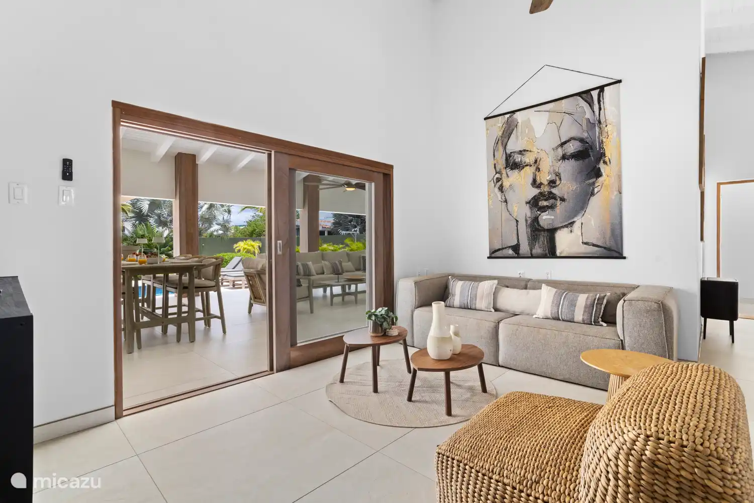 Kas Sinku - Sunrentals Bonaire living room with sofa and view of covered porch