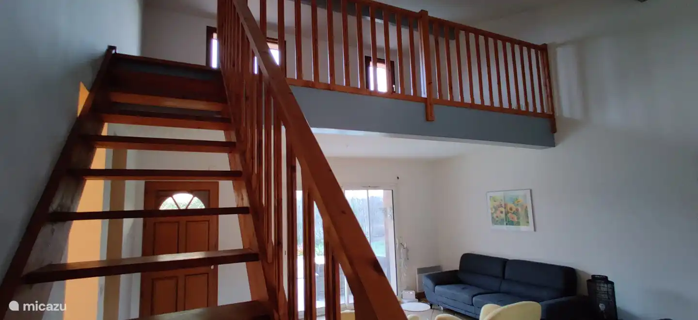 The loft upstairs is equipped with a reading corner, desk and foosball table.
