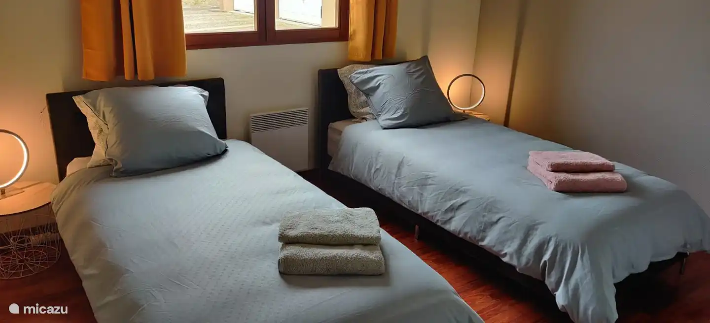 The third bedroom has two single beds, which can also be pushed together.