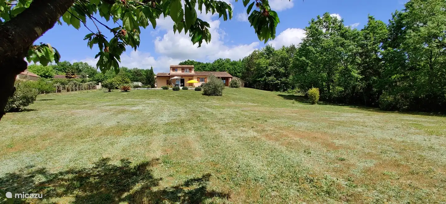 From the large garden, the house seems far away.