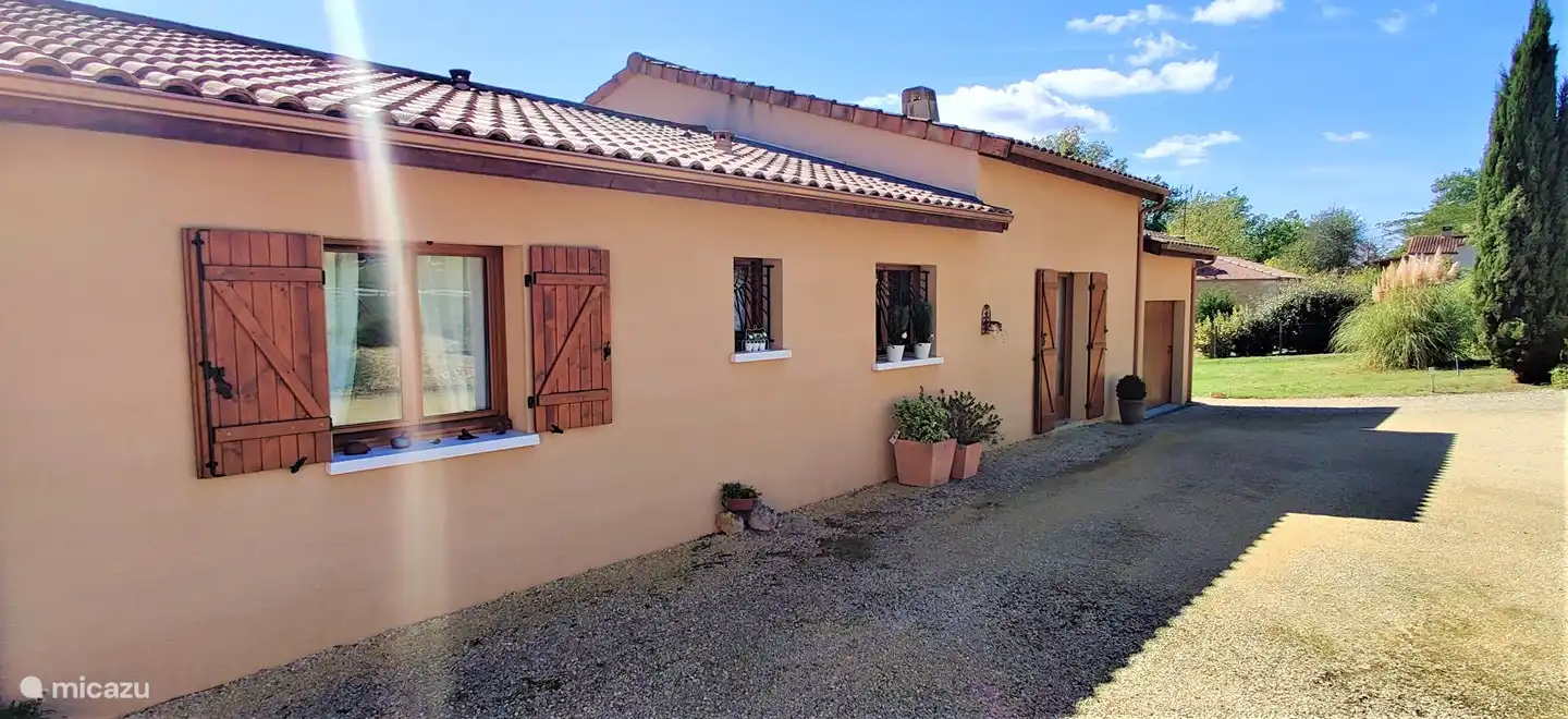 The front of the house, at the entrance.