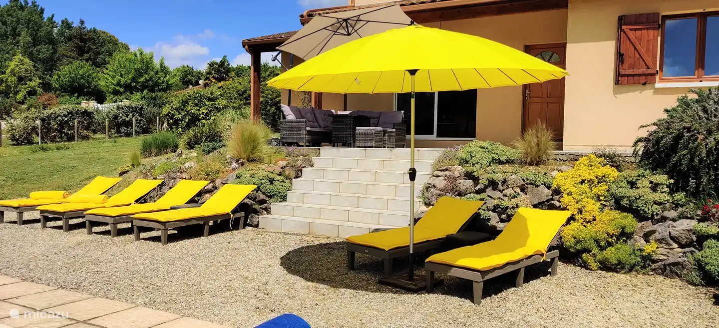 Yellow is the color of Villa Padam. The outdoor beds, the umbrellas, and more.