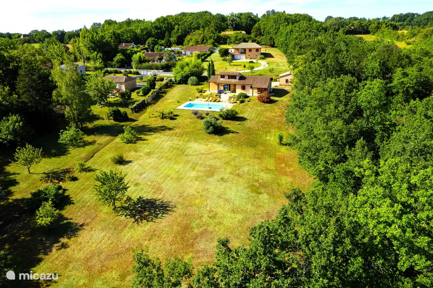 The house with swimming pool and large garden.