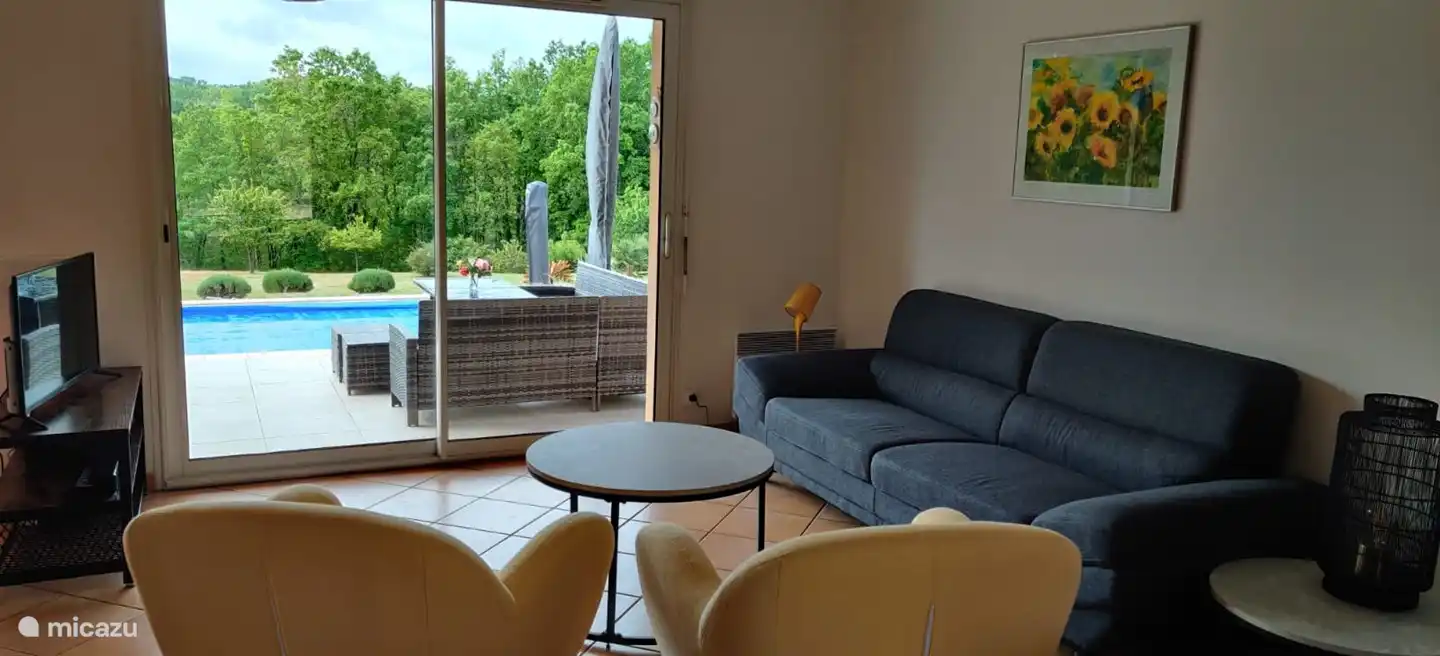 Inside, the house is fully furnished, for example the sitting area.