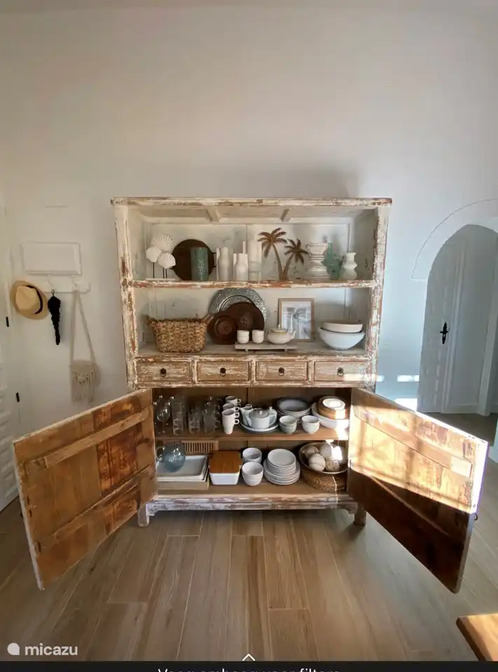 Sideboard with the crockery and all necessities.