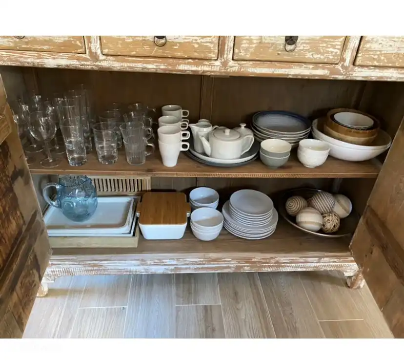 Contents behind the sideboard doors.