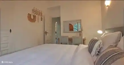 The side table with mirror and 2 chairs.