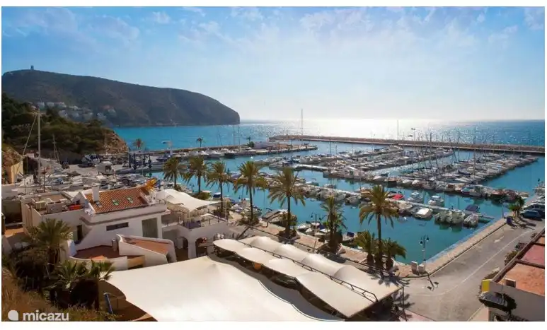 The view of the marina from the road to El Portet.