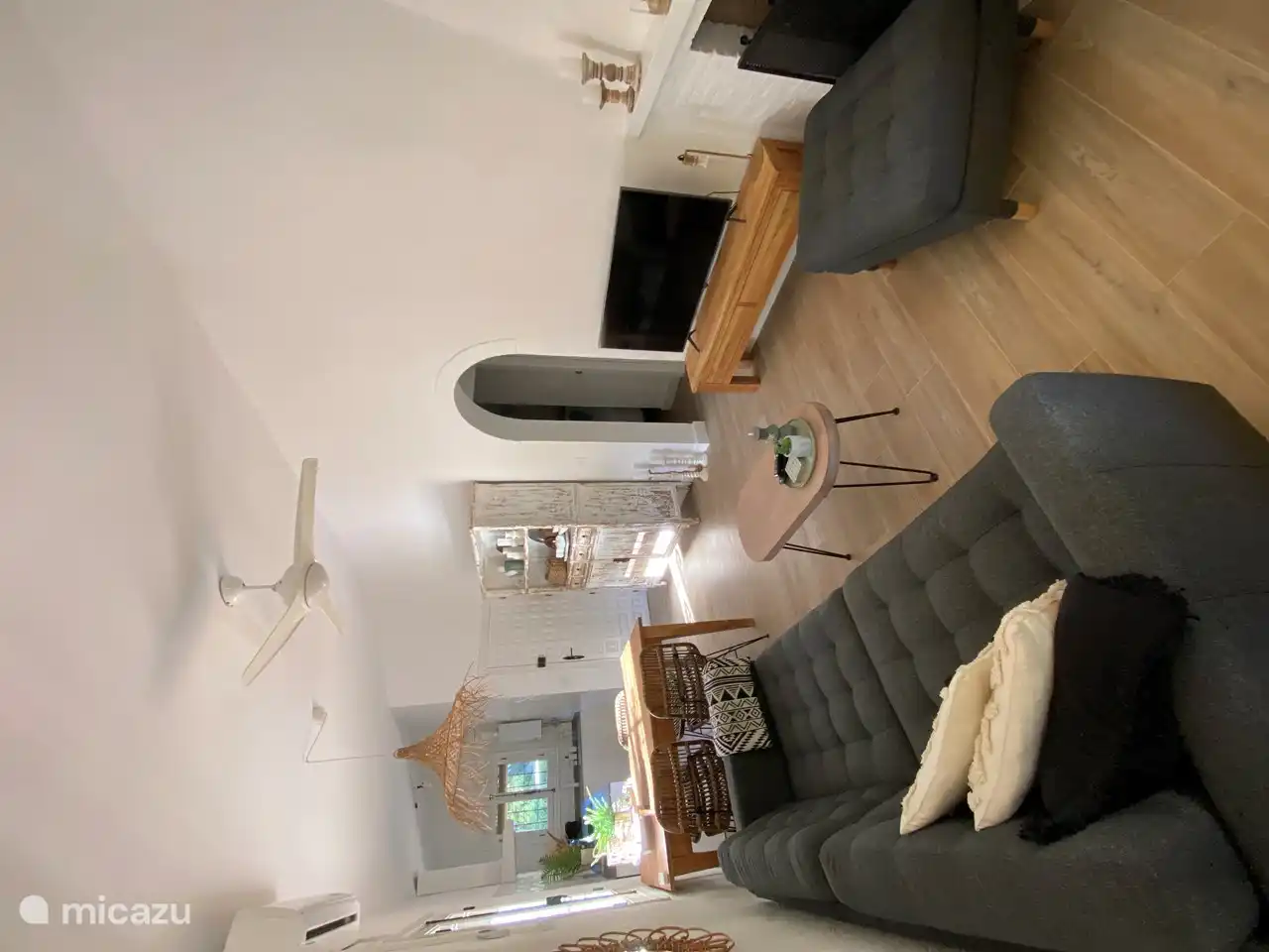 and through the French doors we step back into the living room. Through the bar on the way to the bedrooms and bathroom..