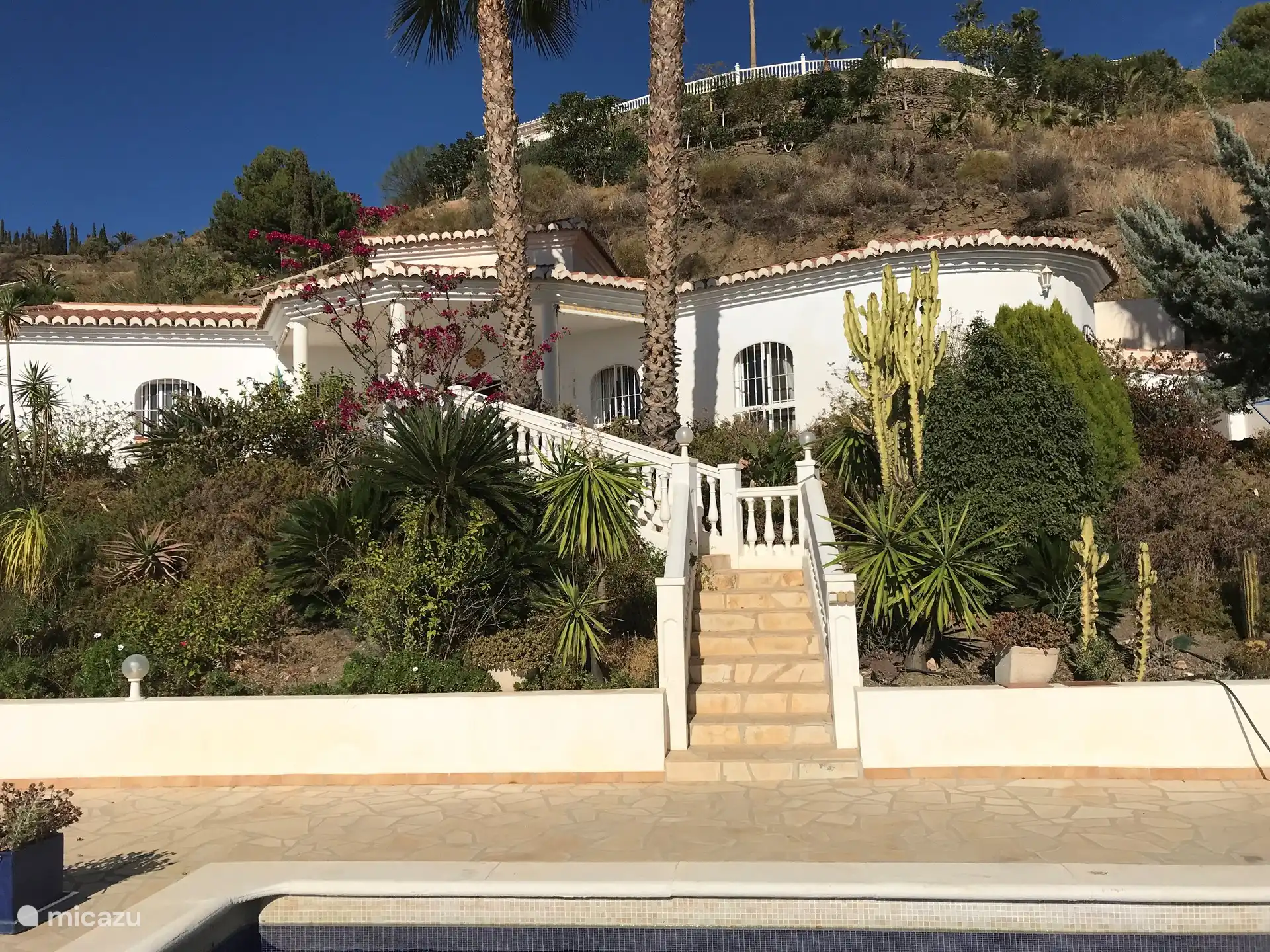 The view of the villa from the pool terrace. The staircase can be locked at the top.