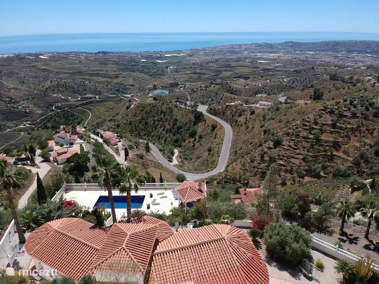 The top view of the villa with views over the Mediterranean Sea with Velez M&#225;laga in front on the right and Torre del Mar on the coast.

