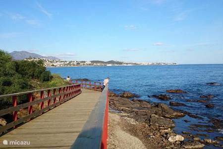 Walking on the decking path at La Cala de Mijas along the coast.