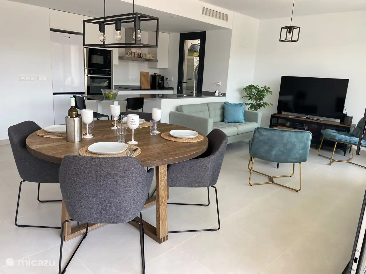 The living room is spacious and equipped with all comforts.