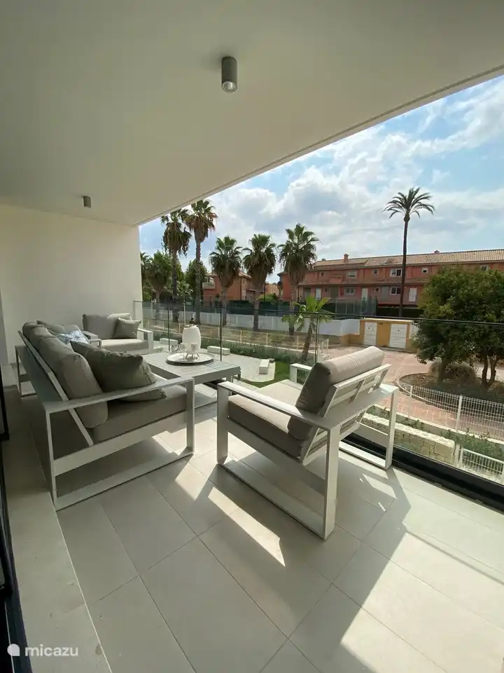 Spacious balcony with lovely lounge set