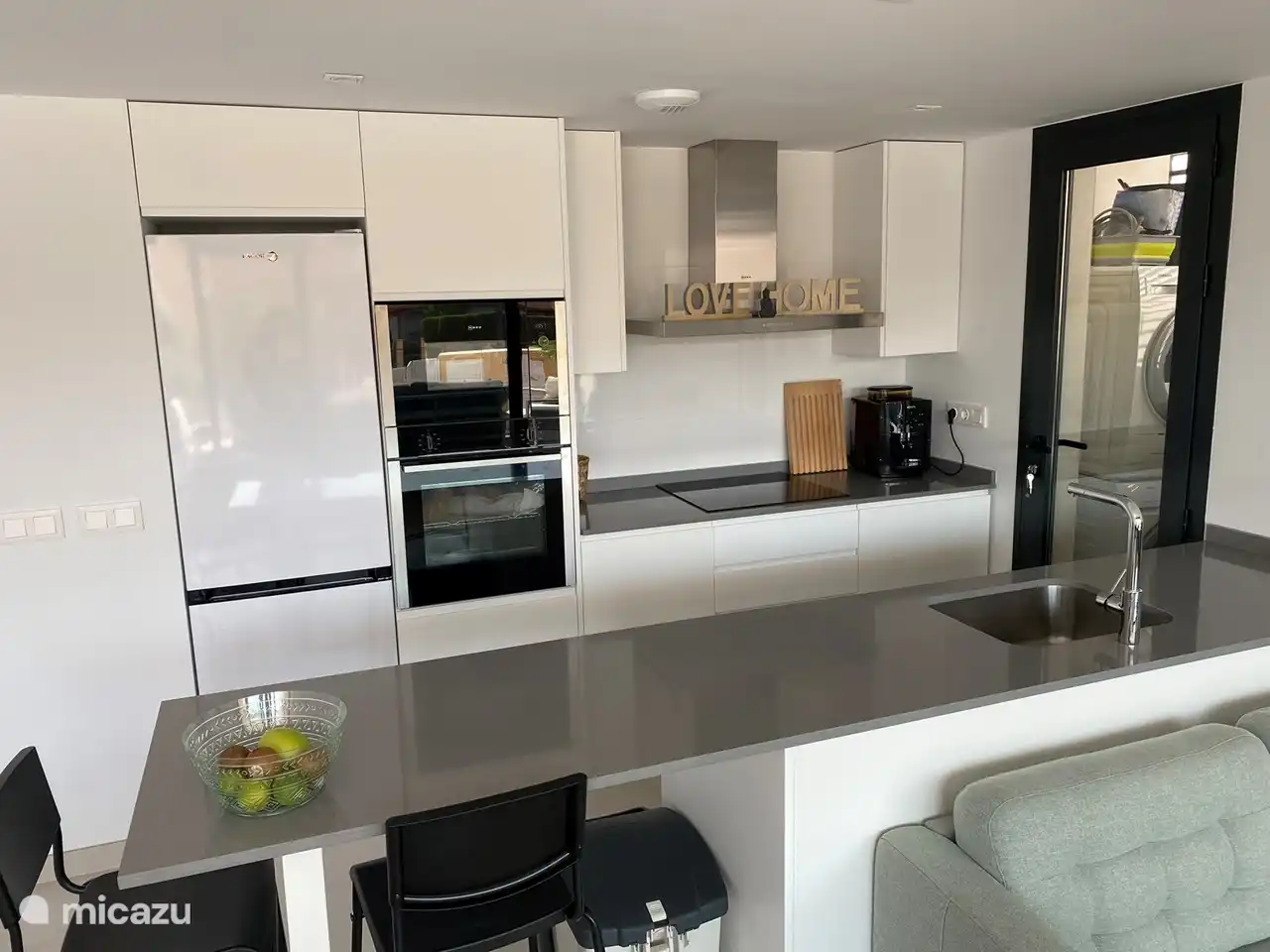 The open kitchen is fully equipped