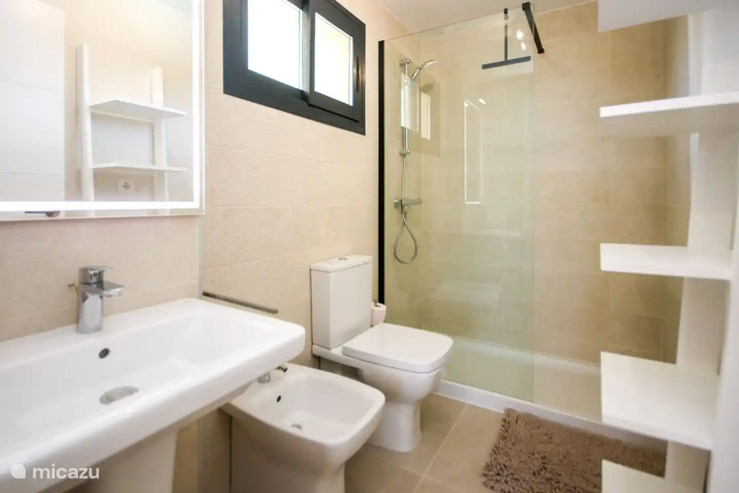 en-suite bathroom with walk-in shower, sink and toilet.