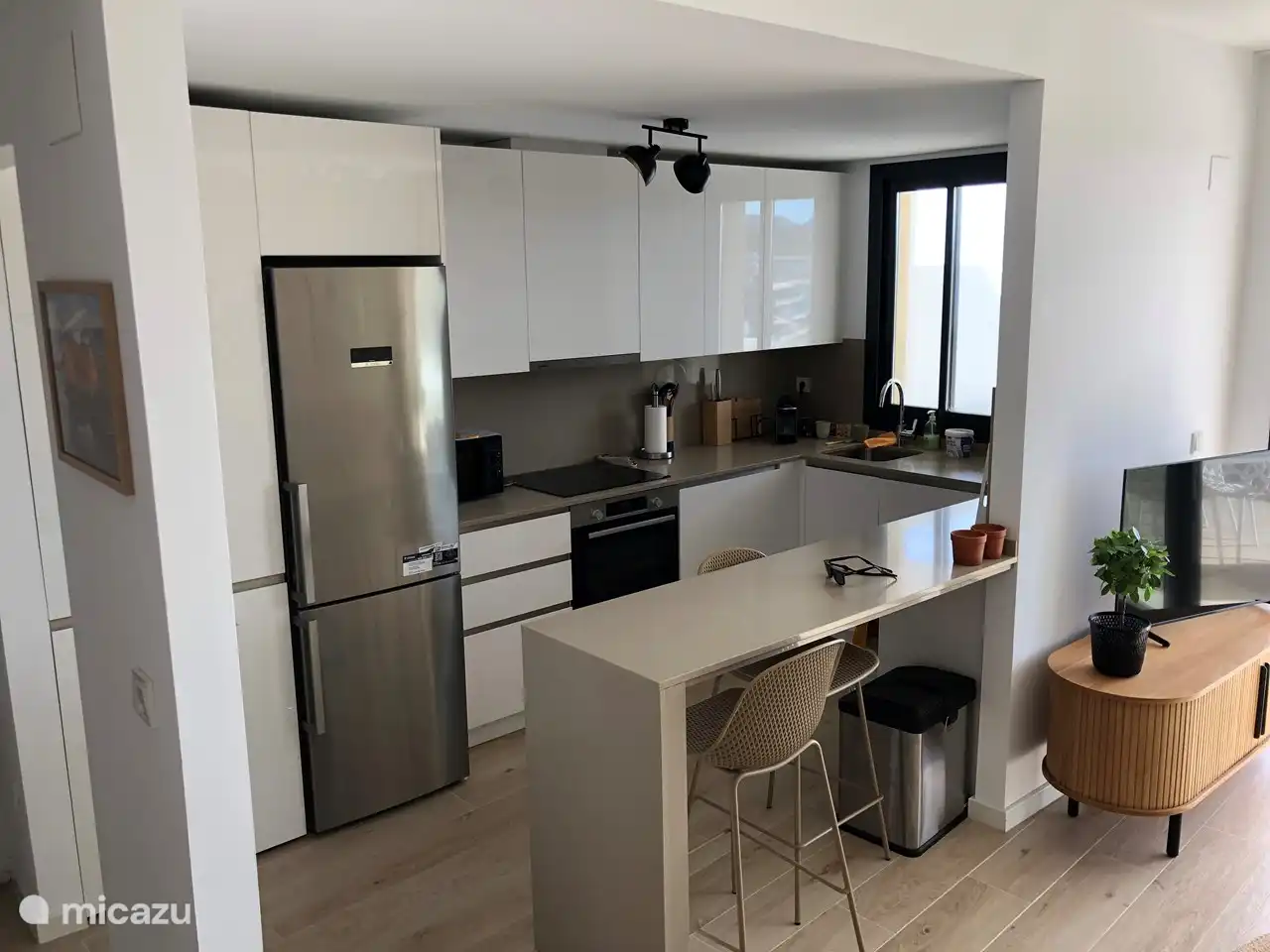 open kitchen with dishwasher, washing machine etc.