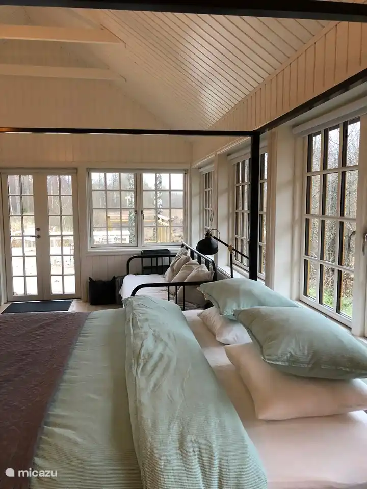 A spacious 180 wide bed and a sofa bed that can be pulled out and also sleeps 2. 