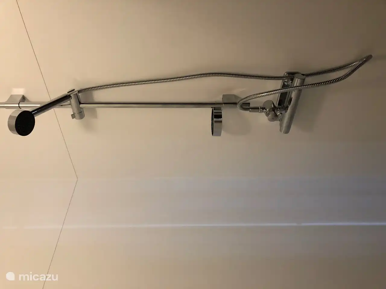 The bathroom with shower and toilet is located a few steps from the cottage and is shared with other guests