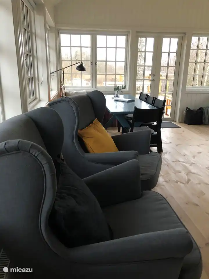 The garden house with comfortable chairs and a spacious dining table