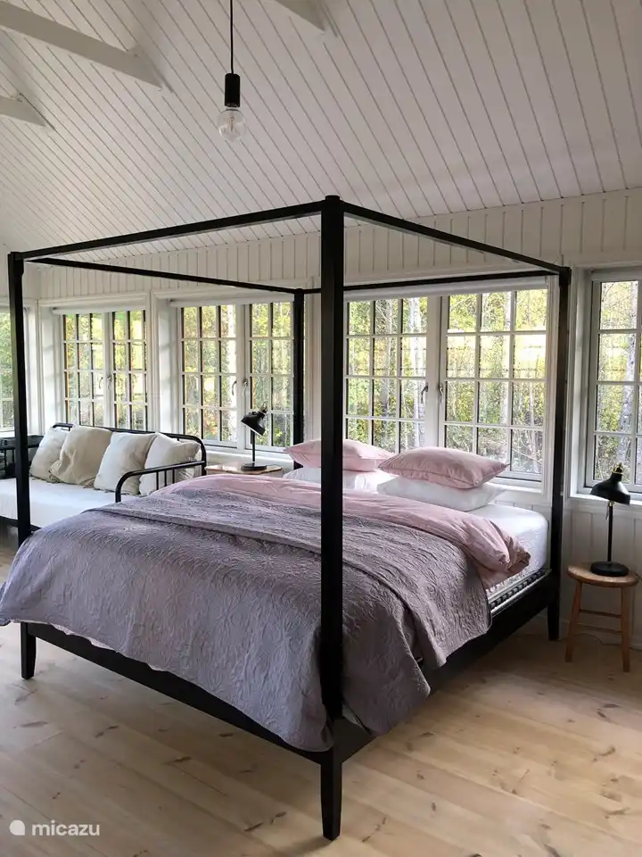 the four-poster bed and the 2 person sofa bed