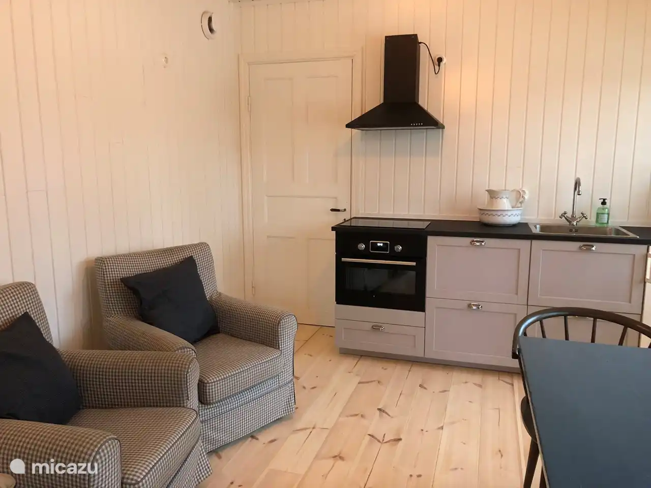 A nice kitchen with an induction hob (2 pans) and an oven. 