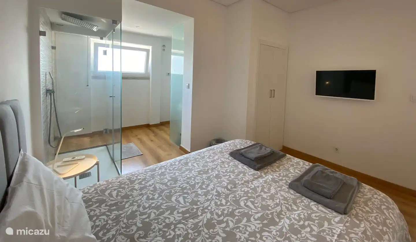 modern en-suite bedroom with river views