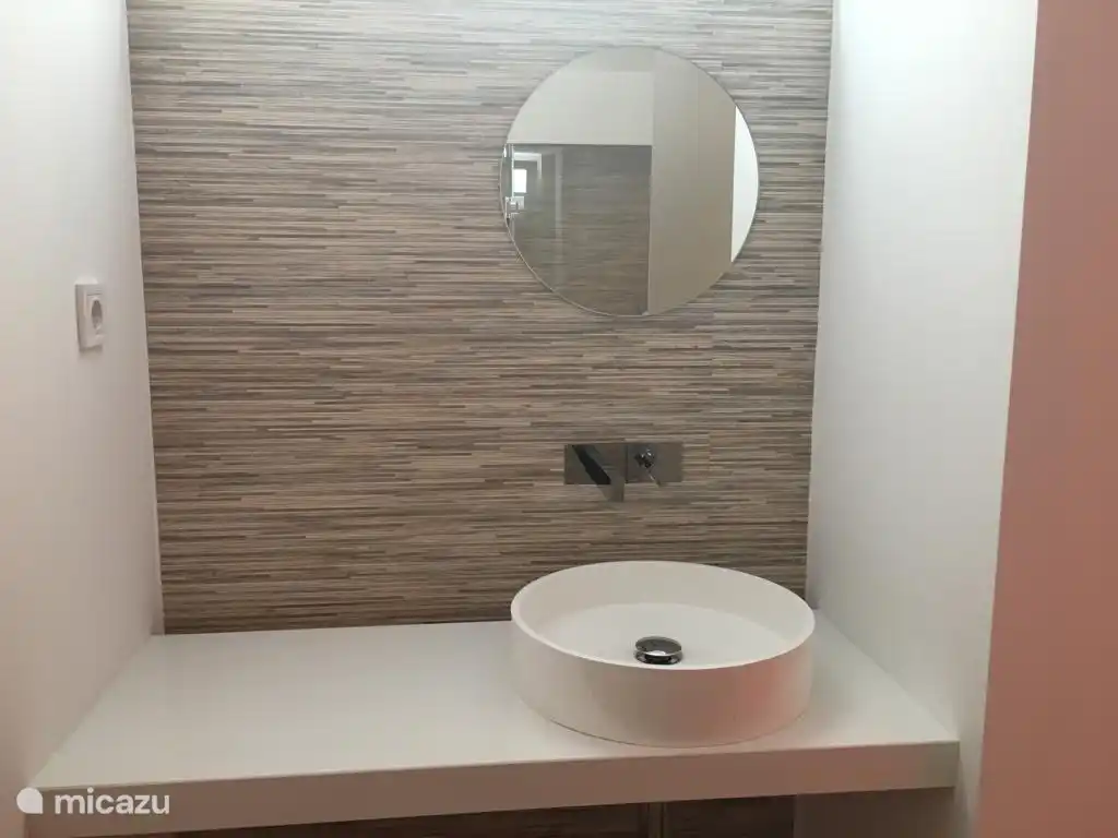 modern en-suite bedroom with river views