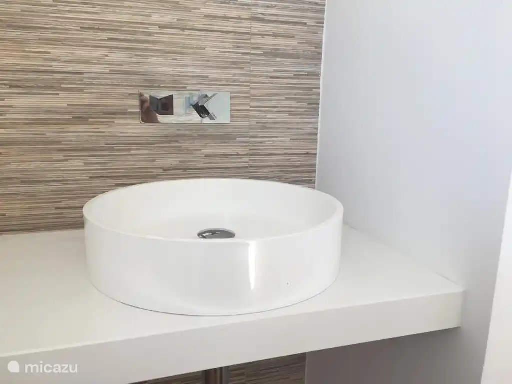 modern en-suite bedroom with river views