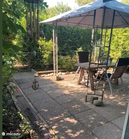 Relax in the shade of the garden pavilion.