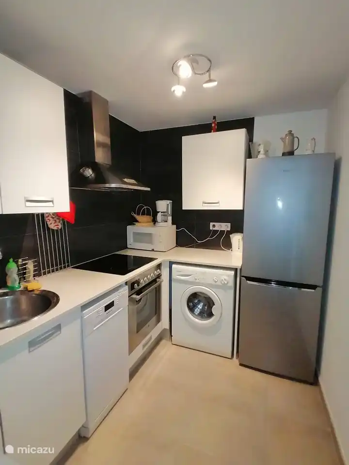Complete kitchen with oven, microwave, dishwasher, washing machine and large refrigerator
