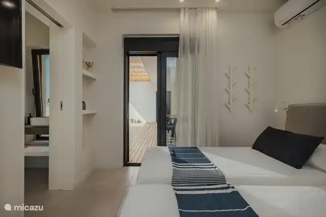 Habitación 1 con dos camas separadas