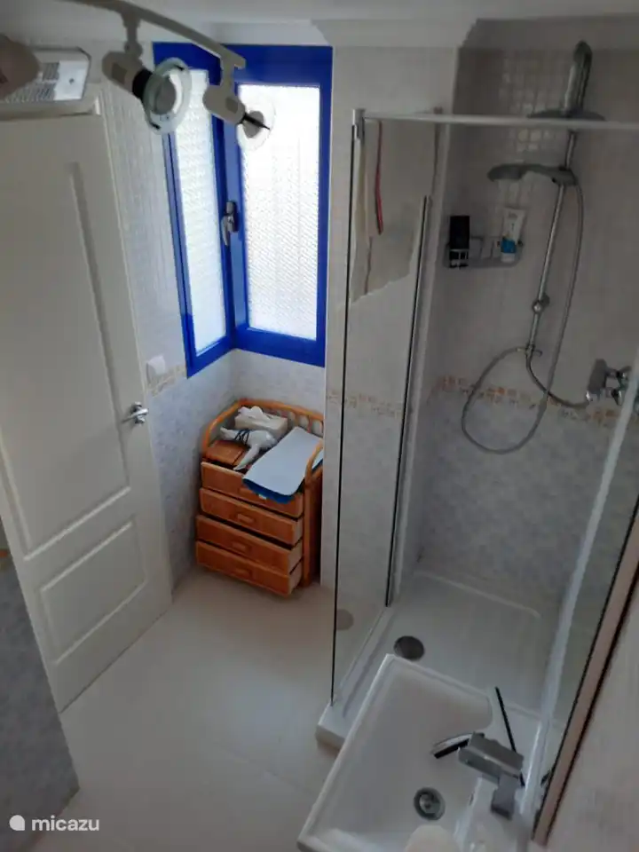 Bathroom 1 (ensuite) with shower, sink and toilet.