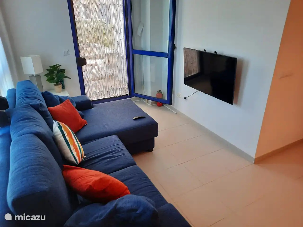 Another view of the living room with Samsung Smart TV.