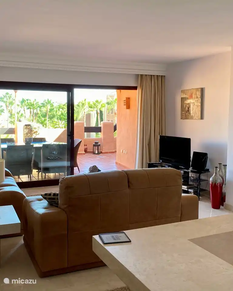 Living room with TV, apple TV and cozy sitting area