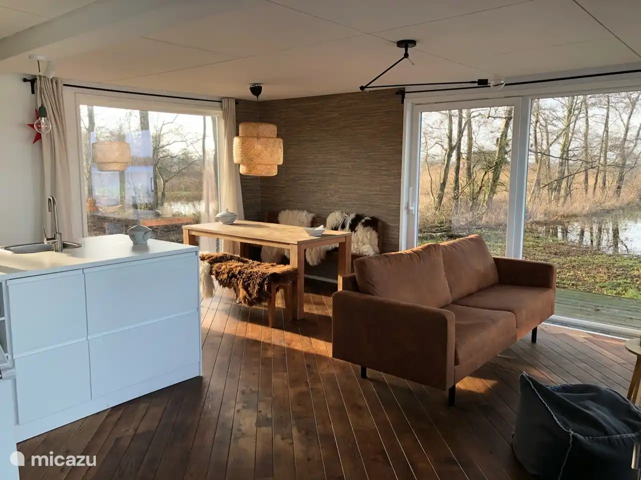 The dining area with both a view of the lake and the ditch next to the house