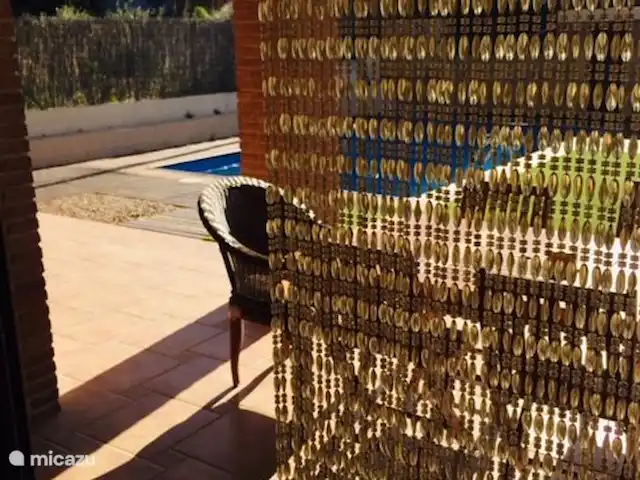 Casa José Ramón en España, Costa Dorada, Tarragona - casa vacacional Ventana corredera a terraza desde el comedor/salón.