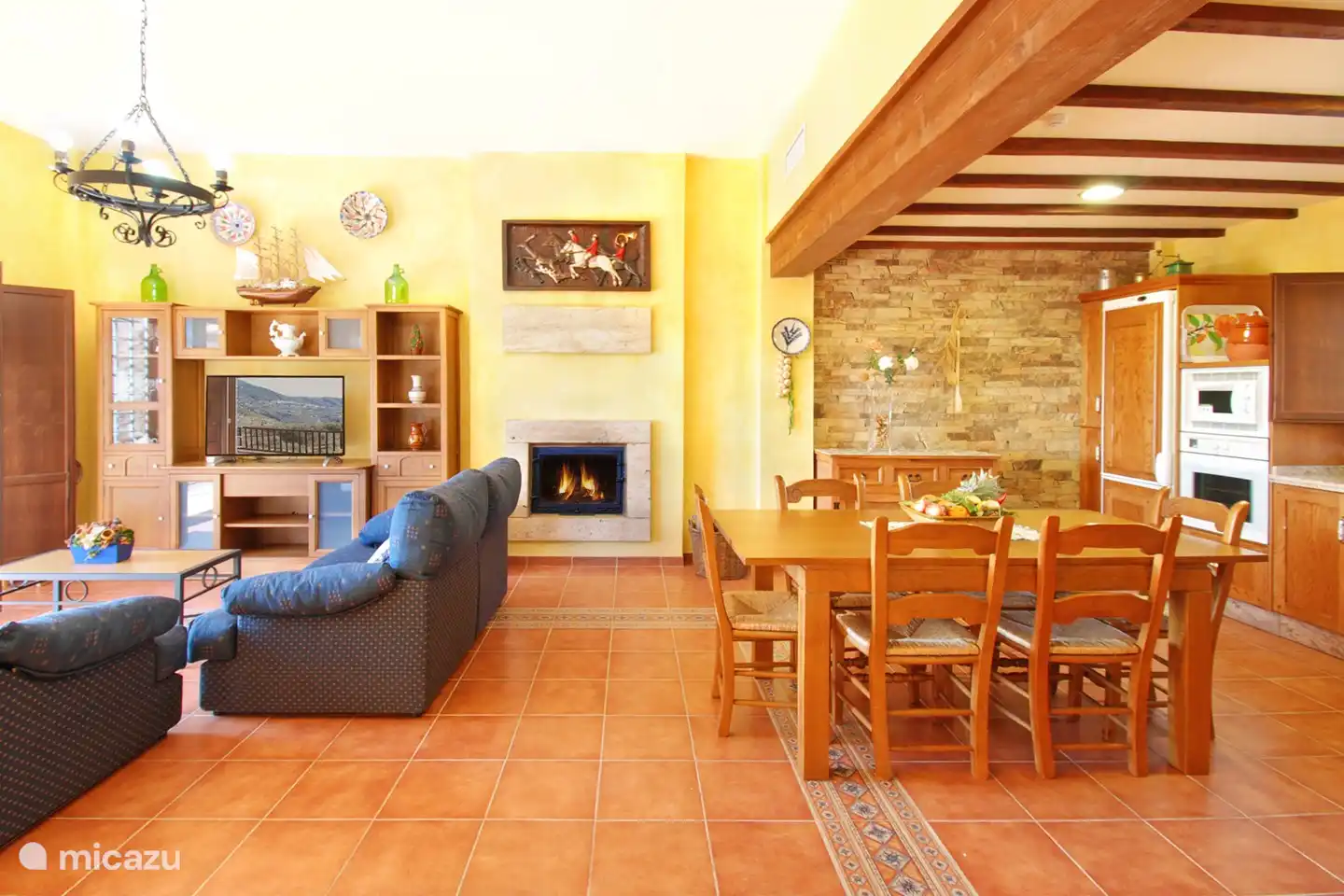 The living room with lounge, large open kitchen and dining area.