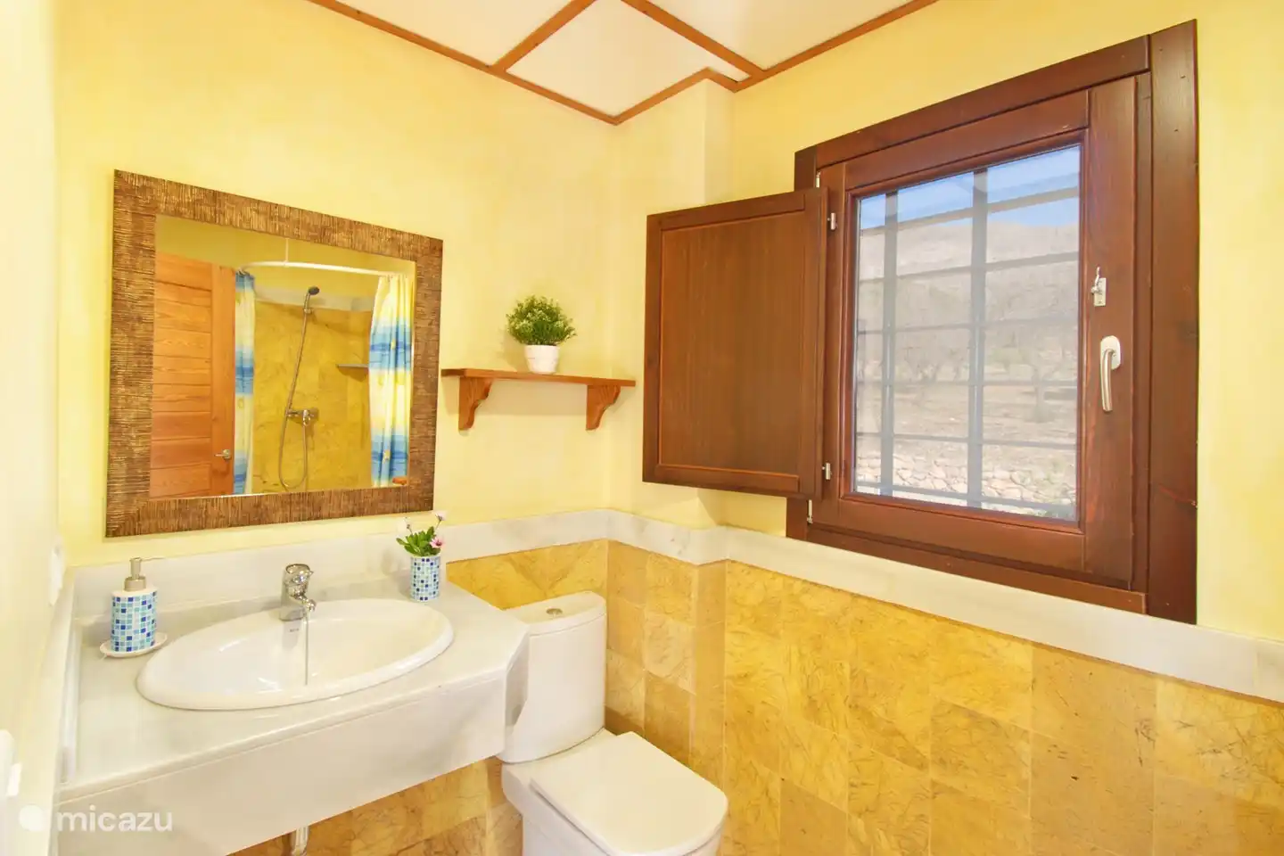 The en-suite bathroom has toilet, bidet, shower and sink.