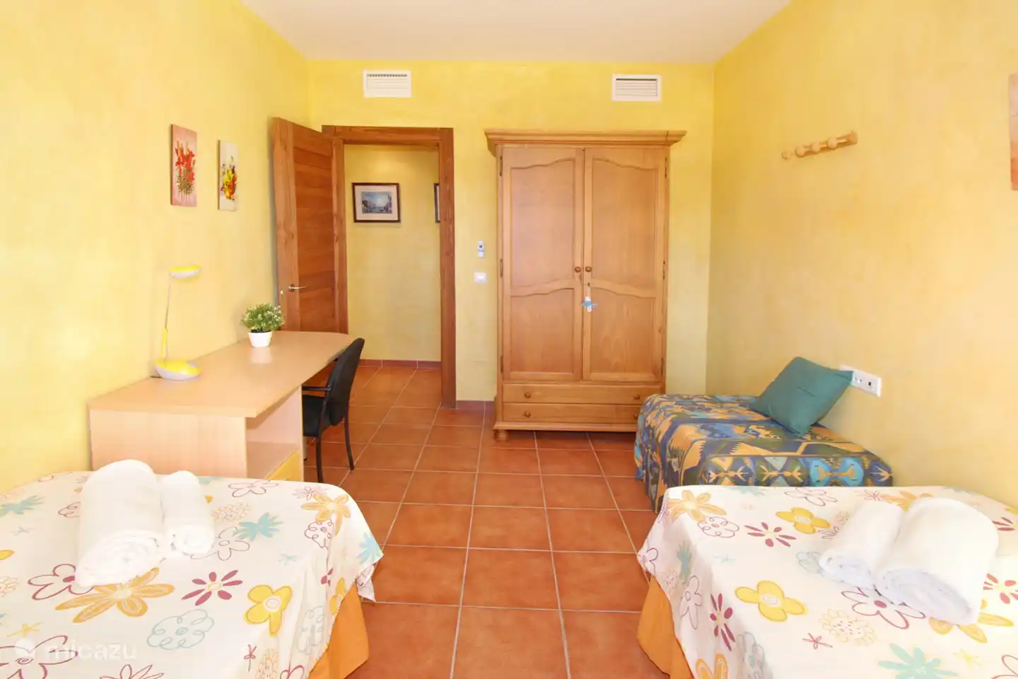 There is WIFI throughout the house, including in the room with the desk corner.