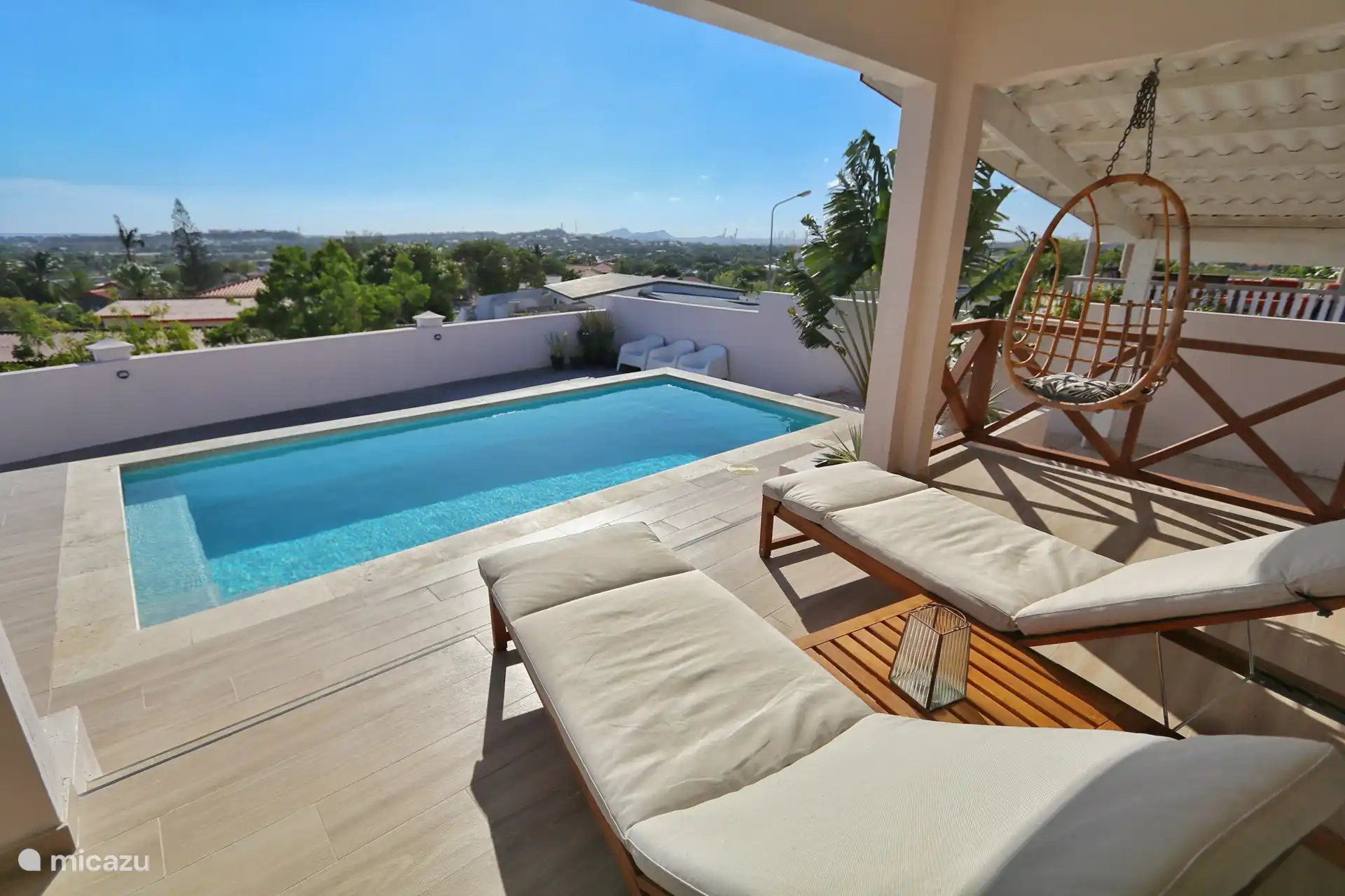 Views from the porch over the private pool and over a large part of Curacao