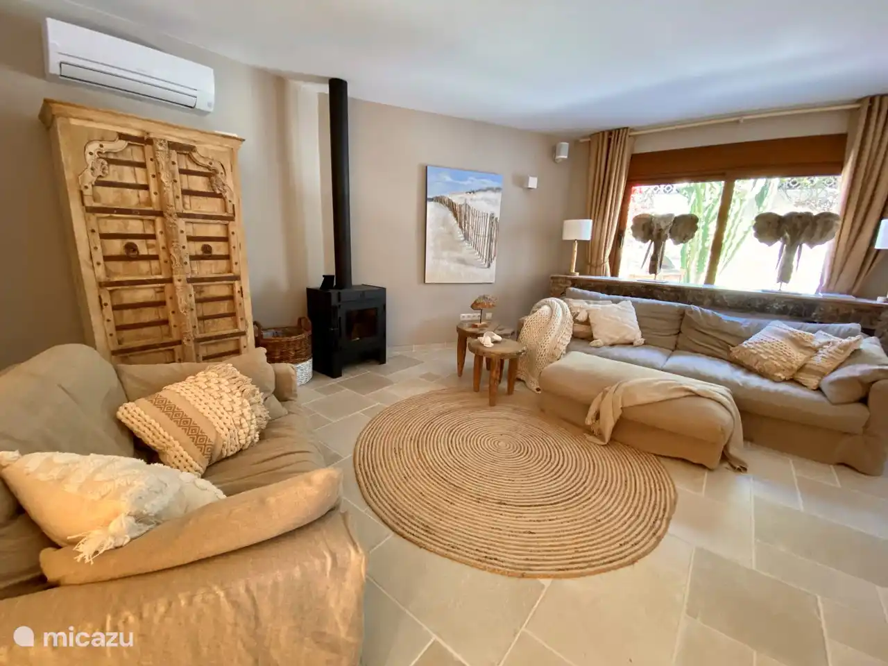 Cozy living room with wood-burning fireplace and underfloor heating