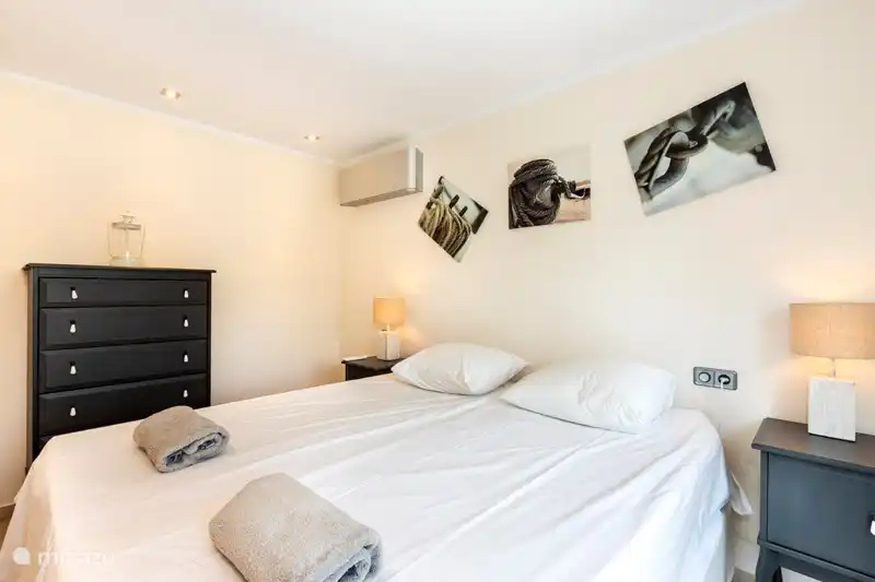 Cozy spacious bedroom with chest of drawers and wardrobe. Double beds that can also be pushed apart if desired.