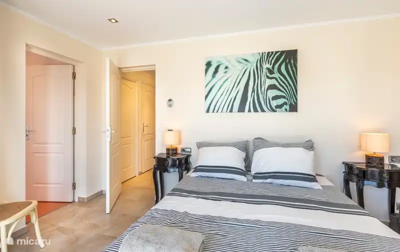 Master bedroom with wardrobe and chest of drawers.