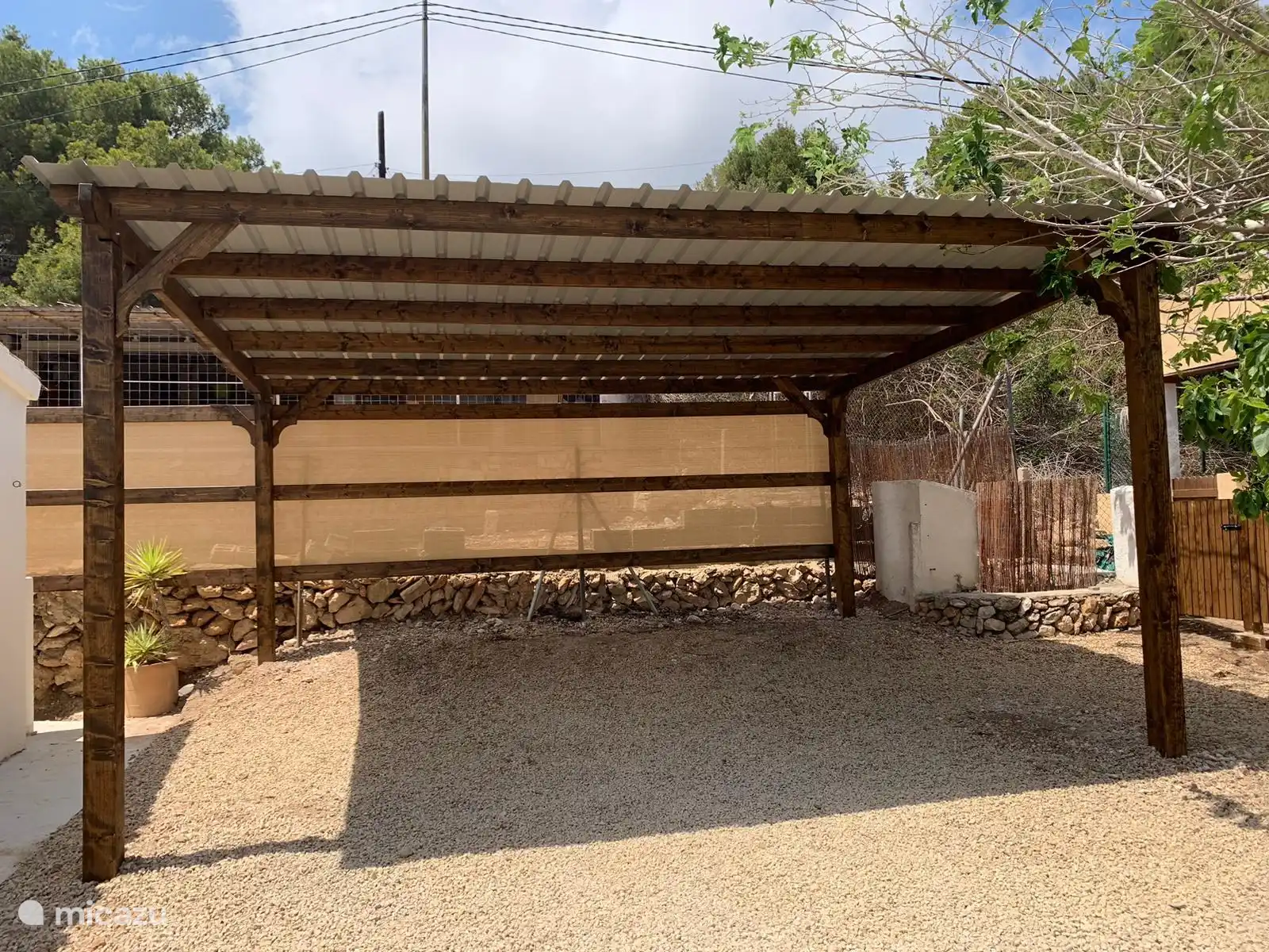 There is room for 2 cars in this new carport 